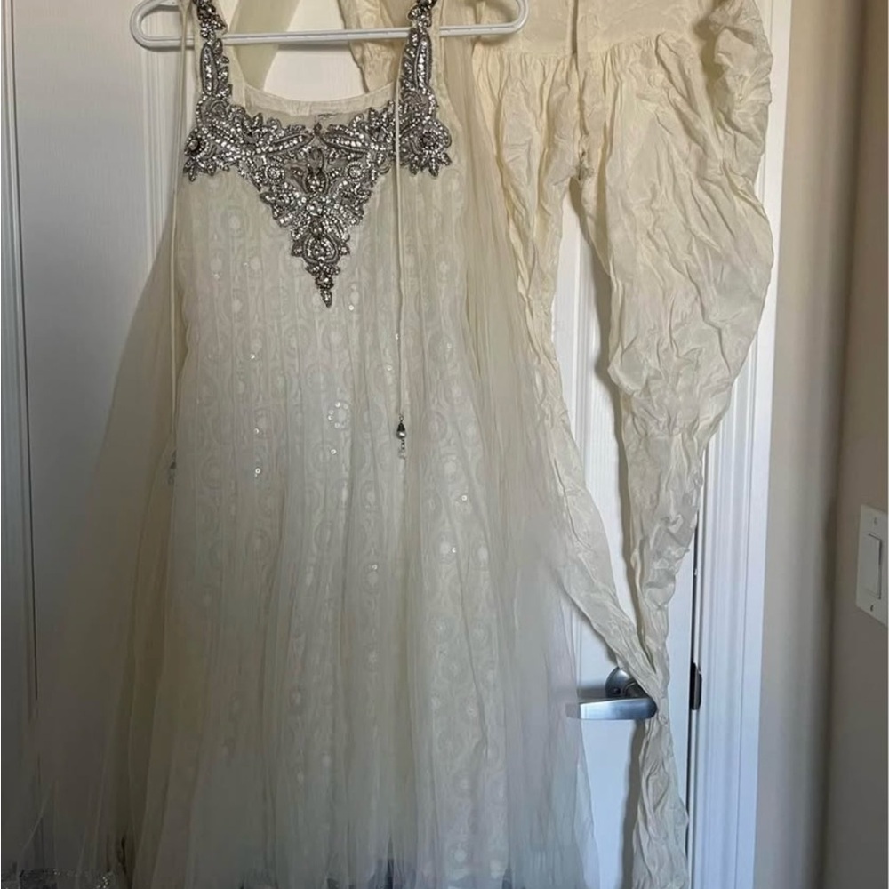 Elegant Cream Dress with Silver Embellishments